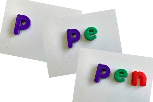 Magnetic letters showing the blending of 'pen': the 'p', then 'pe', then 'pen'.
