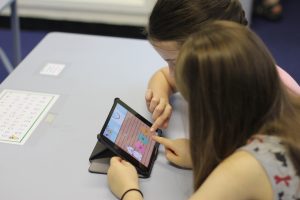 Tutors running group phonics session