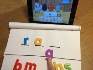 Tutor and child working one-to-one using Phonics Hero